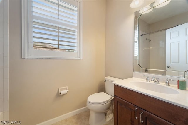 bathroom with vanity, toilet, and tile patterned floors