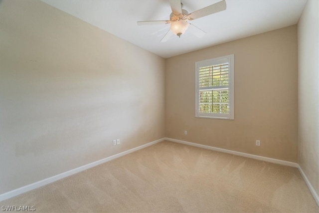 carpeted empty room with ceiling fan