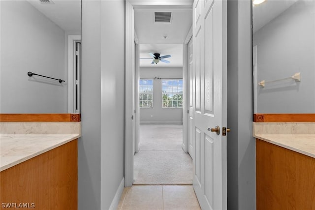 bathroom with ceiling fan, tile patterned flooring, and vanity