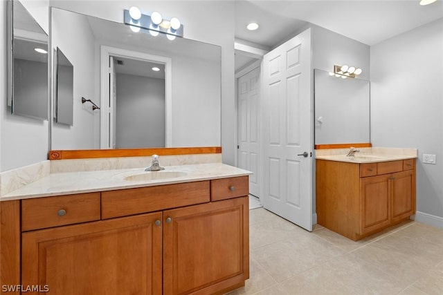 bathroom with tile patterned floors and vanity