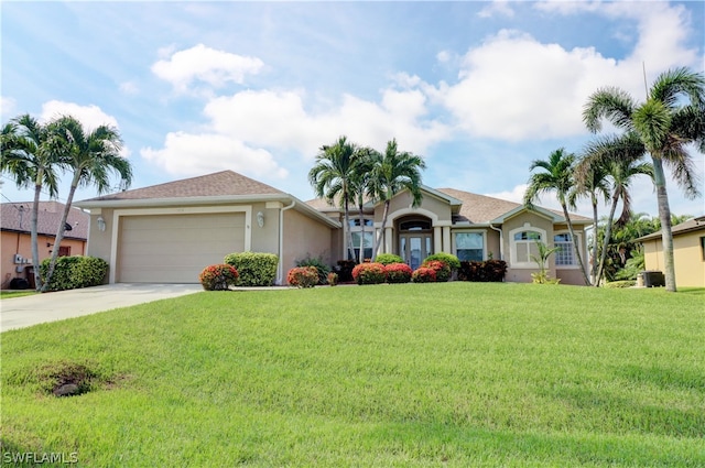 ranch-style house with a garage and a front lawn