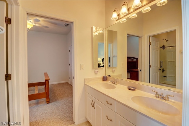 bathroom with bathing tub / shower combination, double vanity, and ceiling fan