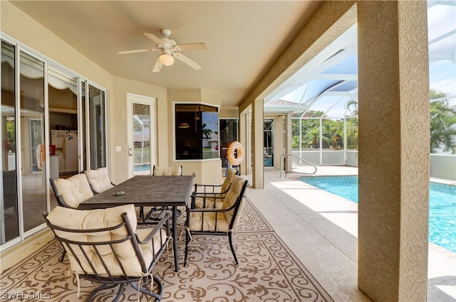 view of patio / terrace featuring a lanai and ceiling fan