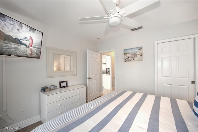 bedroom with hardwood / wood-style floors and ceiling fan