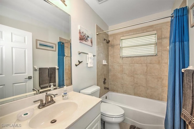 full bathroom with vanity, shower / tub combo with curtain, and toilet