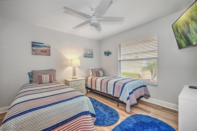 bedroom featuring ceiling fan and light hardwood / wood-style floors