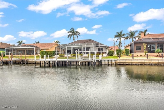 dock area with glass enclosure and a water view