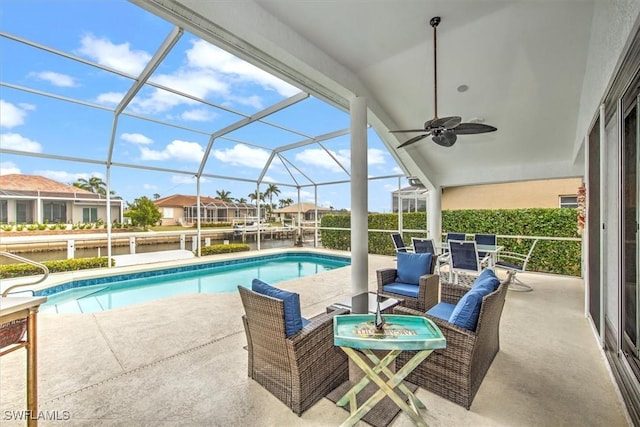 view of pool featuring an outdoor living space, a lanai, and a patio