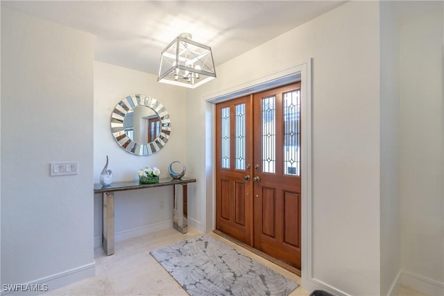 foyer with a notable chandelier