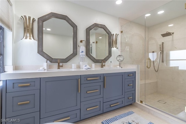 bathroom with vanity, an enclosed shower, and tile patterned floors