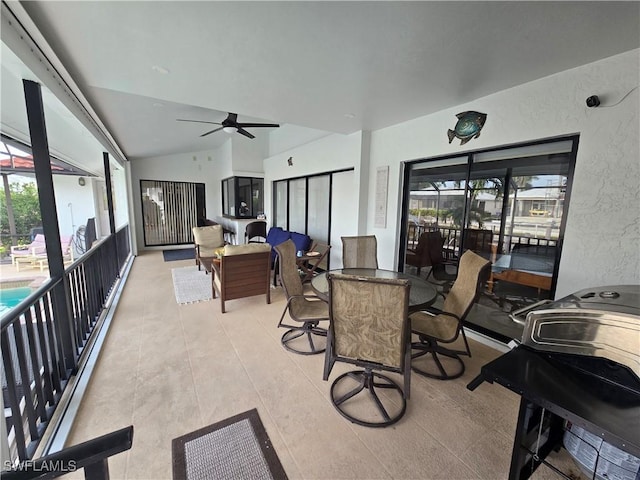 dining area with vaulted ceiling and ceiling fan