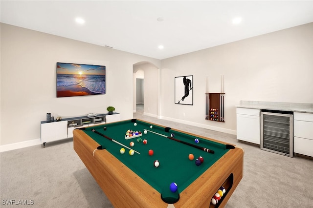 rec room featuring pool table, light carpet, and wine cooler