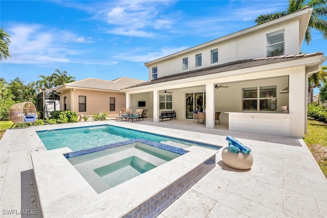 view of pool featuring an outdoor hangout area, an in ground hot tub, ceiling fan, and a patio area