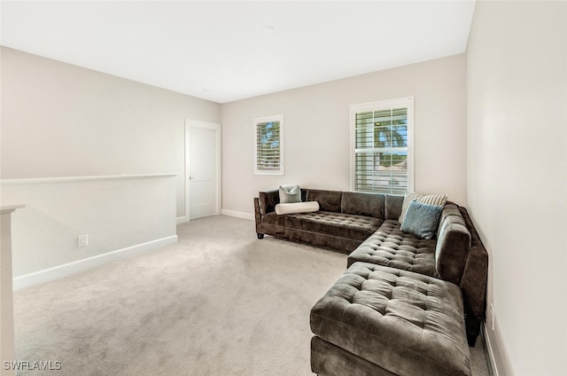 carpeted living room with baseboards