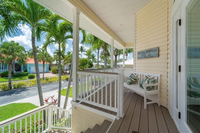 wooden deck featuring covered porch