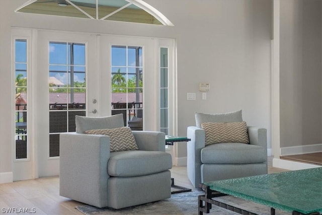 interior space featuring light wood-type flooring and french doors