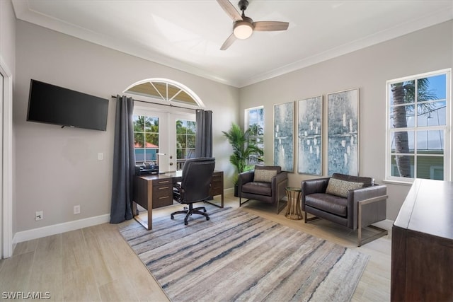 office area with ornamental molding, light hardwood / wood-style flooring, ceiling fan, and french doors