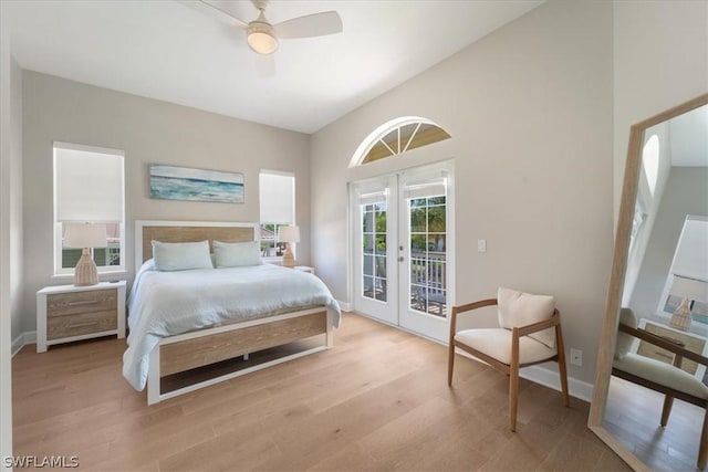 bedroom with french doors, lofted ceiling, light wood-type flooring, access to outside, and ceiling fan