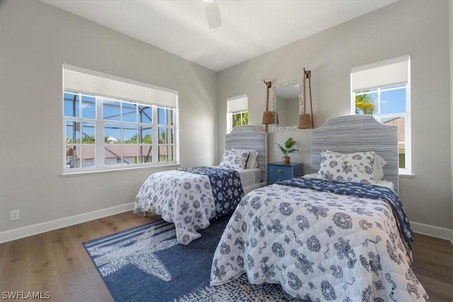 bedroom featuring ceiling fan and wood-type flooring