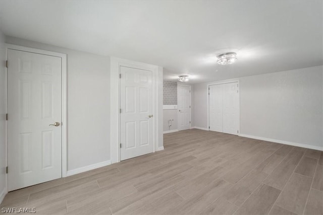 basement with light wood-type flooring