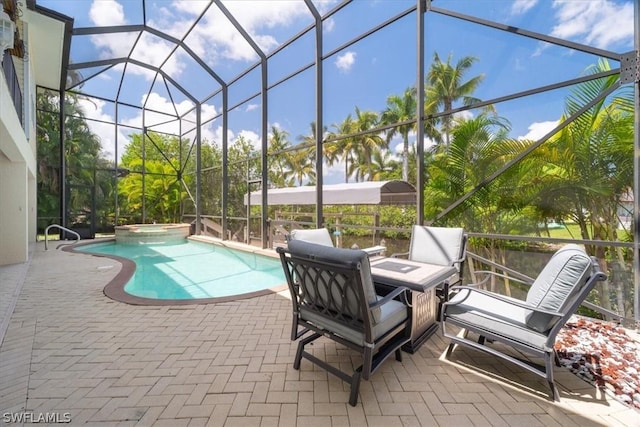 view of swimming pool featuring a lanai, a patio, and an in ground hot tub