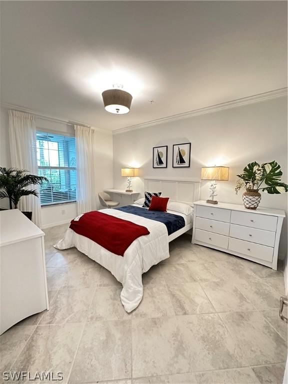 bedroom with crown molding