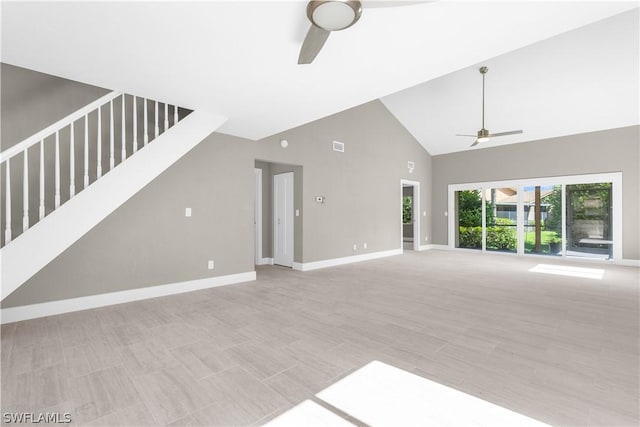 unfurnished living room with high vaulted ceiling and ceiling fan