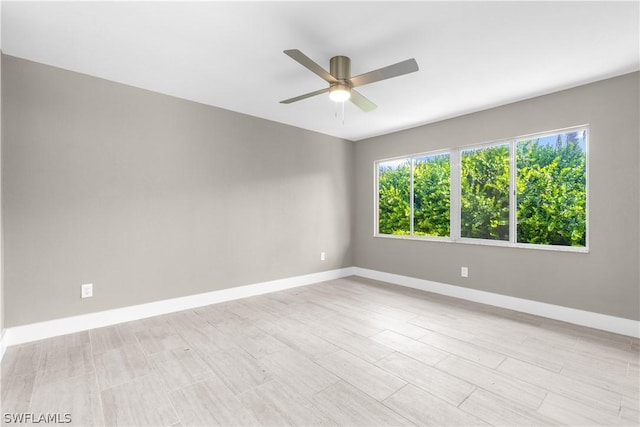 spare room with ceiling fan