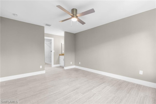 spare room with ceiling fan