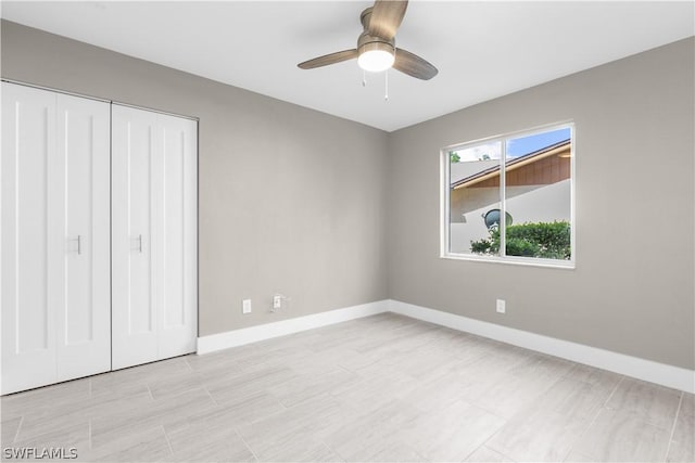 unfurnished bedroom with a closet and ceiling fan