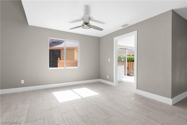 unfurnished room with ceiling fan