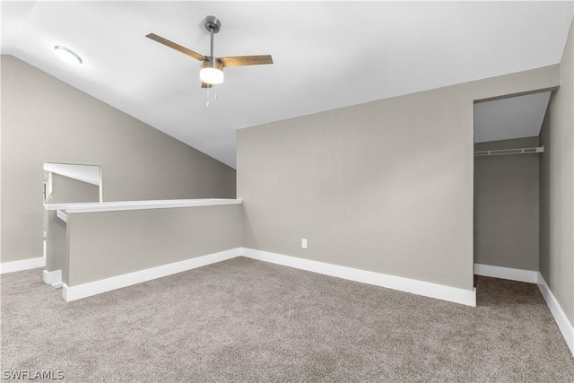 additional living space featuring ceiling fan, carpet, and lofted ceiling