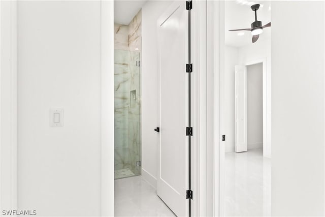 bathroom with ceiling fan and a shower with shower door