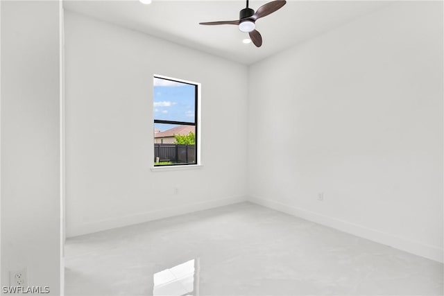 spare room with ceiling fan and concrete flooring