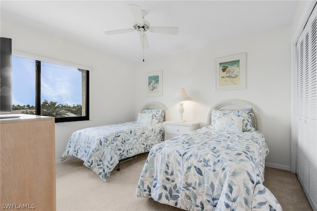 bedroom featuring carpet, a closet, and ceiling fan