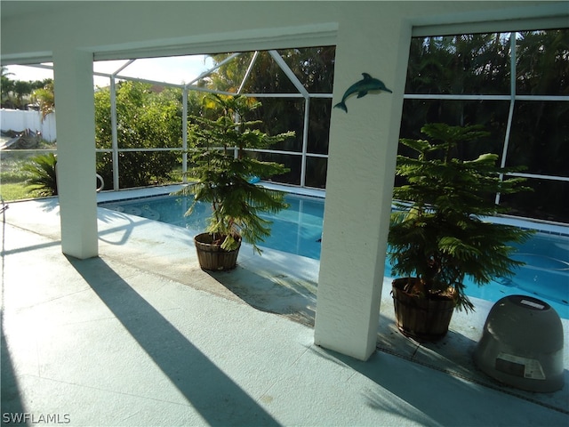 view of pool with a lanai and a patio