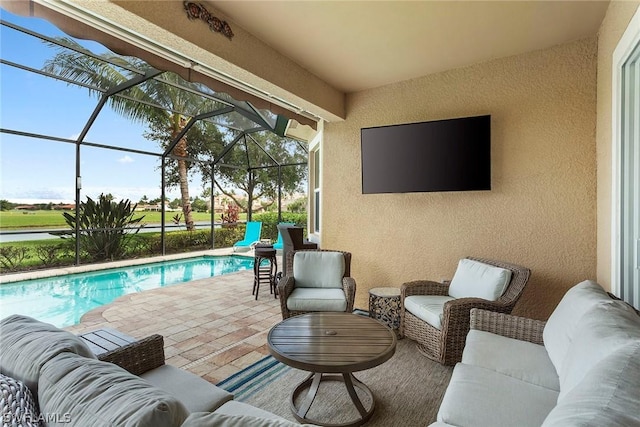 view of patio / terrace featuring a lanai and an outdoor living space