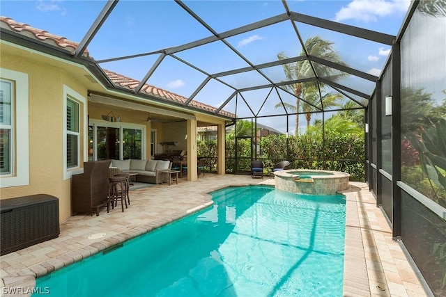 view of swimming pool featuring ceiling fan, an in ground hot tub, glass enclosure, an outdoor hangout area, and a patio