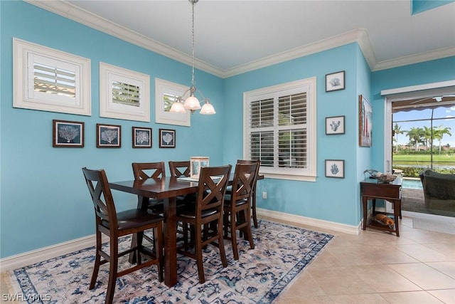 dining room featuring light tile patterned floors, a notable chandelier, and ornamental molding