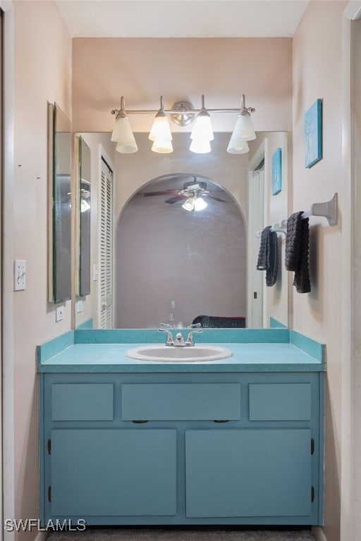 bathroom featuring ceiling fan and vanity