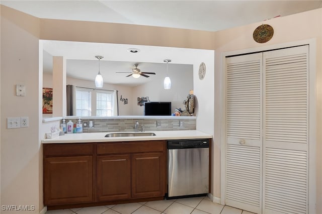 kitchen with backsplash, pendant lighting, sink, stainless steel dishwasher, and ceiling fan