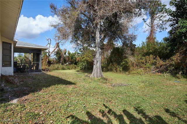 view of yard with a sunroom