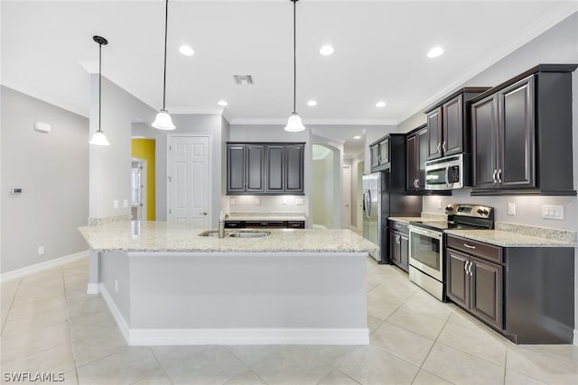 kitchen featuring decorative light fixtures, light stone countertops, stainless steel appliances, crown molding, and a sink