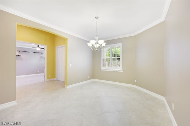 empty room featuring baseboards and ornamental molding