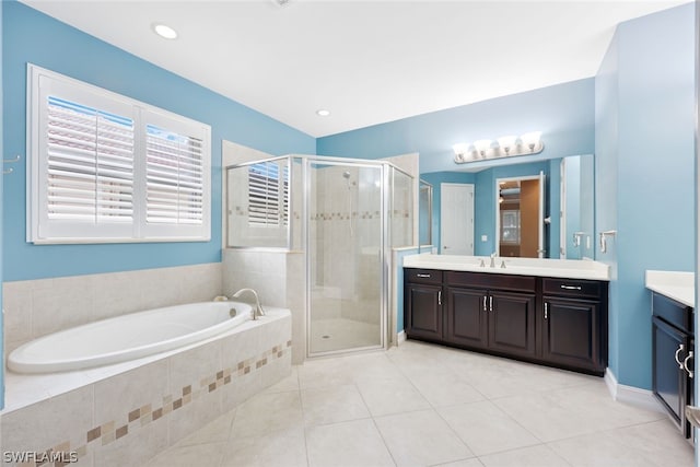 bathroom with a garden tub, tile patterned flooring, vanity, a shower stall, and recessed lighting