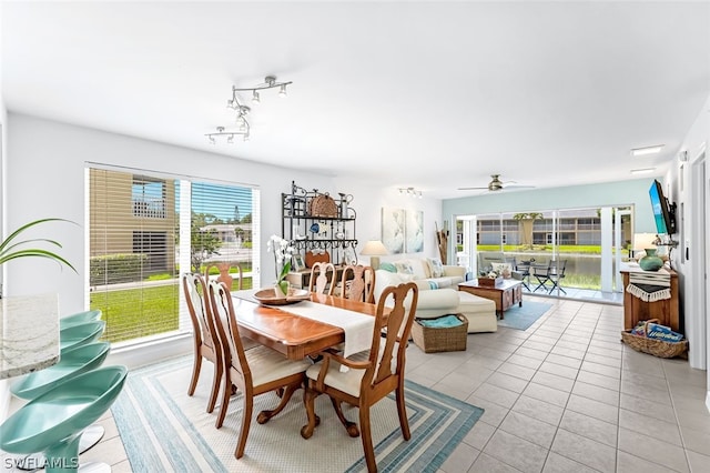 dining area with ceiling fan and light tile patterned floors