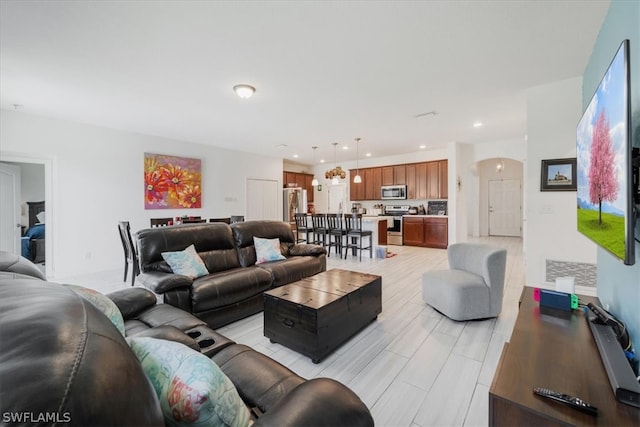 living room with light hardwood / wood-style flooring