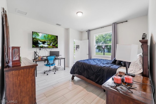 bedroom featuring light hardwood / wood-style floors