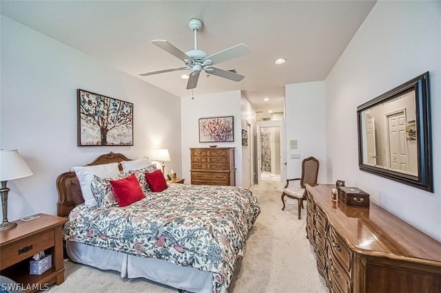 bedroom featuring ceiling fan and light colored carpet