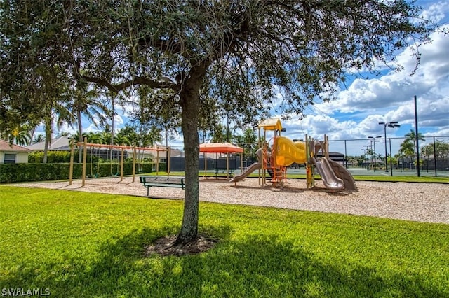 view of jungle gym with a lawn